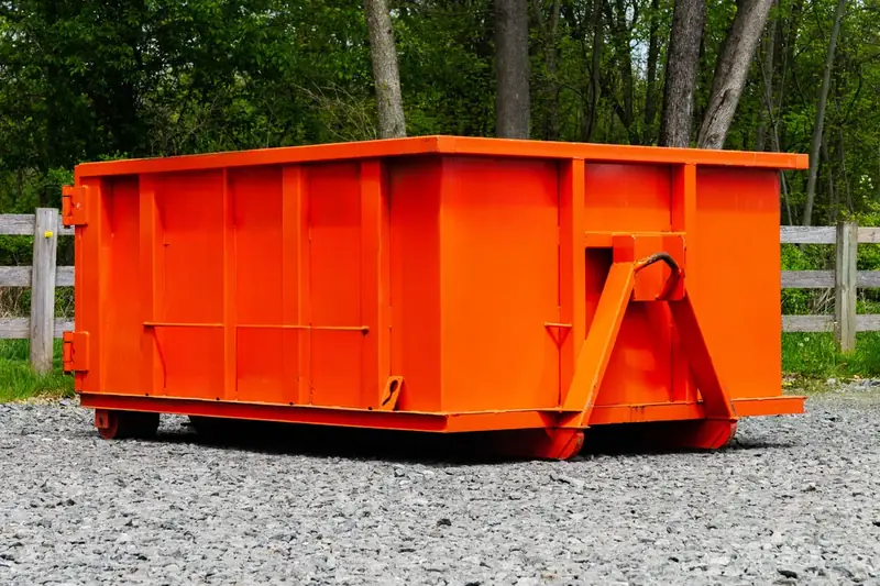 Mid-size roll-off dumpster seen from the side, the size class of a 15-yard